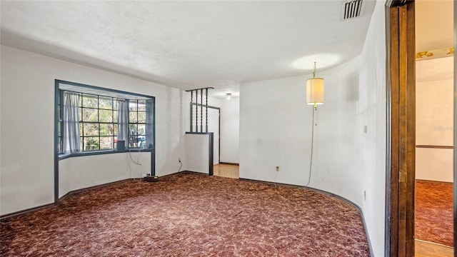 empty room with light colored carpet