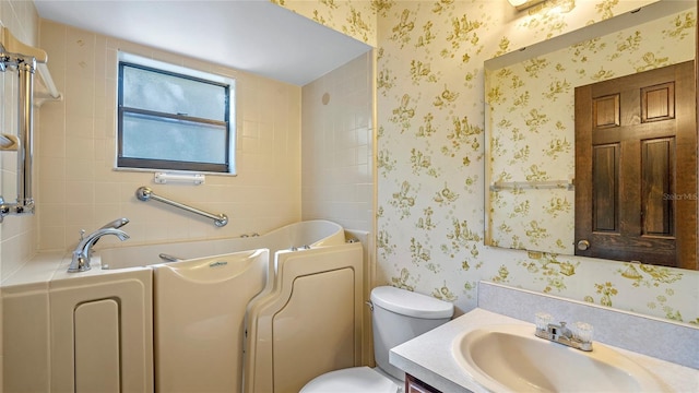 bathroom featuring toilet and vanity