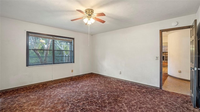 unfurnished room with carpet flooring and ceiling fan