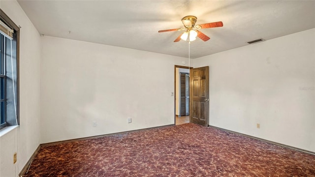 empty room with carpet and ceiling fan