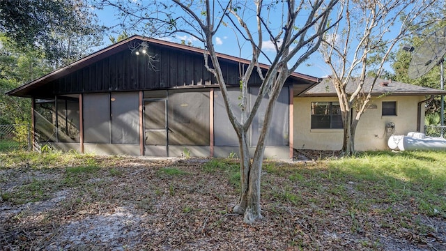 view of property exterior featuring a sunroom