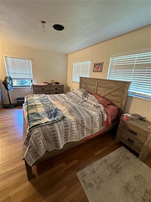 bedroom with hardwood / wood-style floors