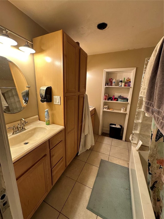 bathroom featuring tile patterned flooring and vanity