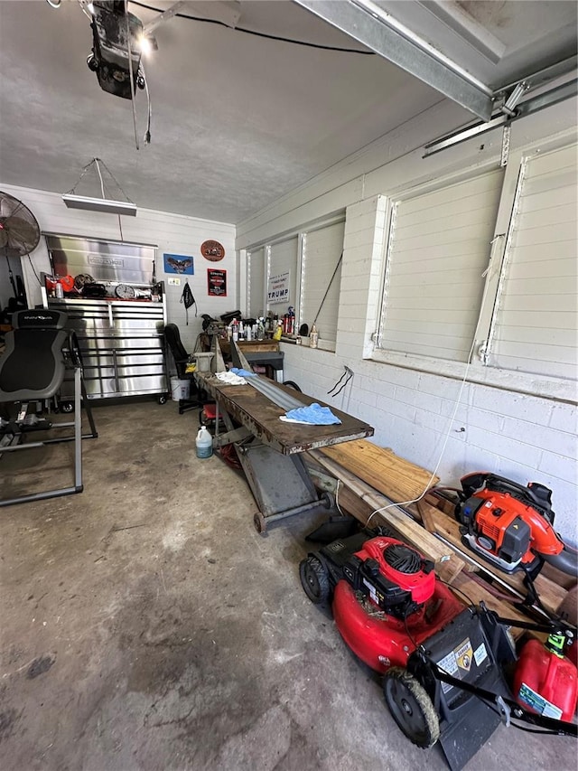 garage featuring a workshop area and a garage door opener