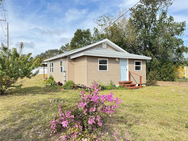 620 Oak St, Auburndale, FL 33823 - view of front of home featuring entry steps and a front lawn