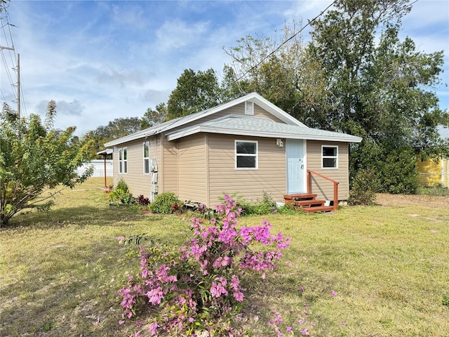 view of front of home with a front yard