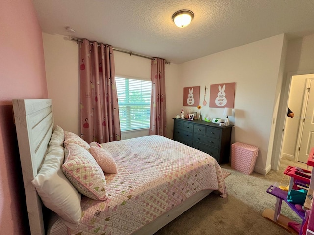 carpeted bedroom featuring a textured ceiling