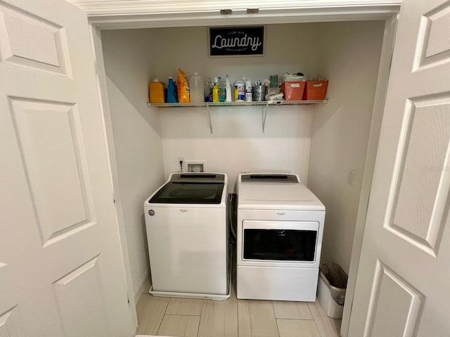 washroom featuring washer and dryer