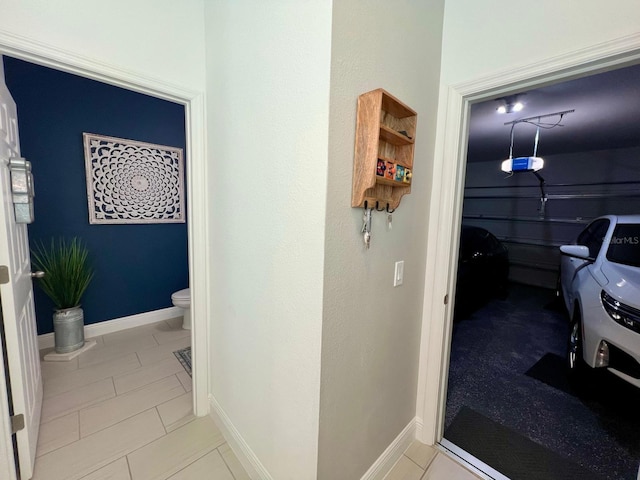 hallway with light tile patterned flooring