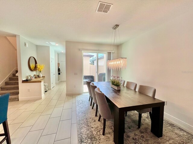 dining area with a textured ceiling