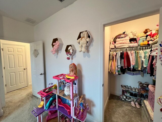 carpeted bedroom featuring a closet