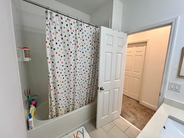 bathroom featuring vanity and shower / bath combo with shower curtain