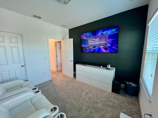 cinema room featuring carpet floors