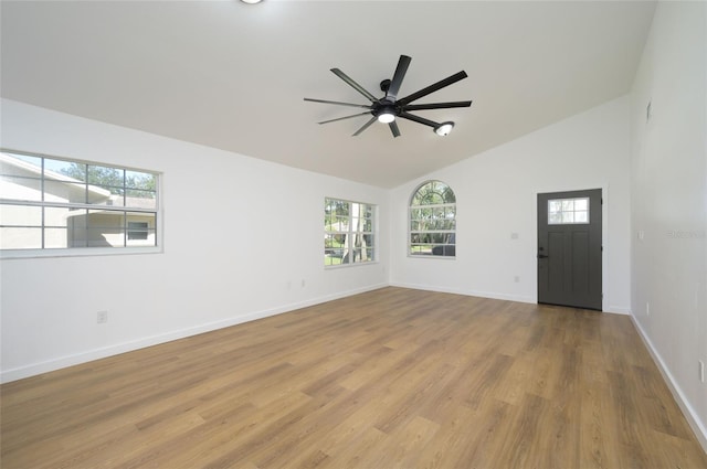 interior space featuring light hardwood / wood-style flooring, high vaulted ceiling, and ceiling fan