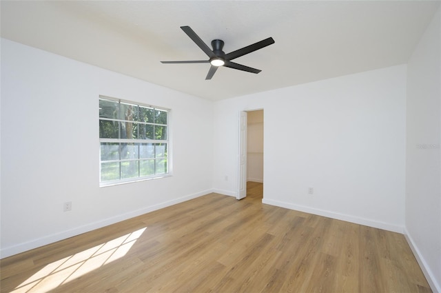 empty room featuring light hardwood / wood-style floors and ceiling fan