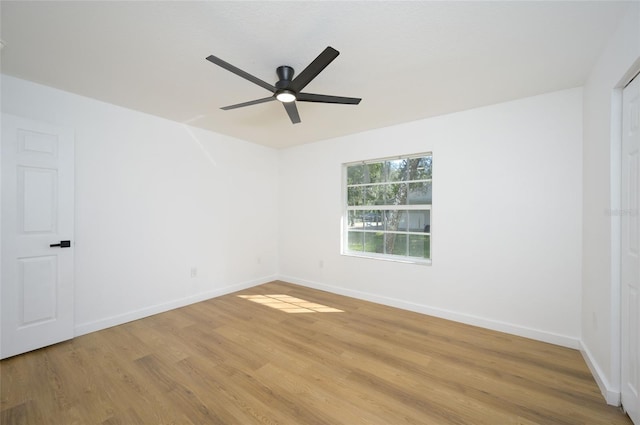 unfurnished room featuring light hardwood / wood-style floors and ceiling fan