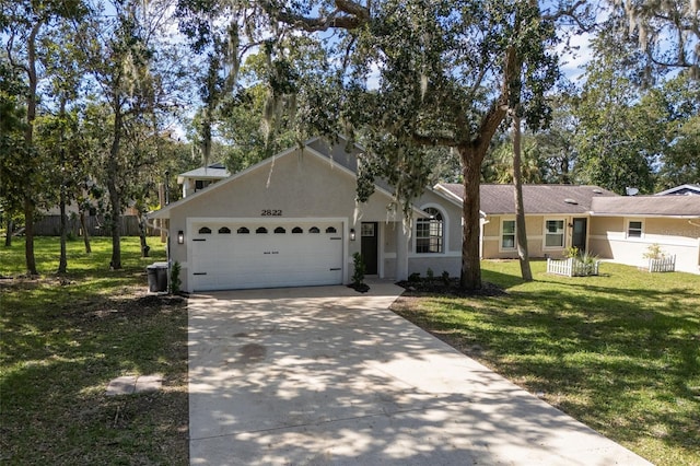 ranch-style home featuring a front lawn and a garage