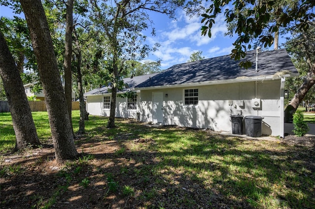 back of house with a yard