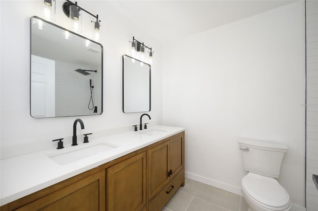 bathroom with vanity, a shower, toilet, and tile patterned floors