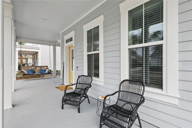 view of patio featuring a porch