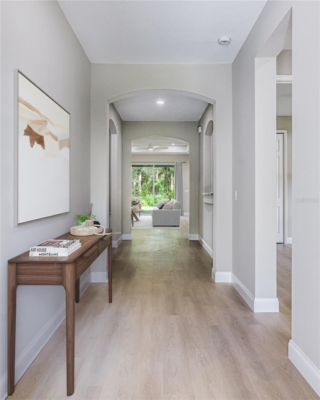 hall with light hardwood / wood-style floors