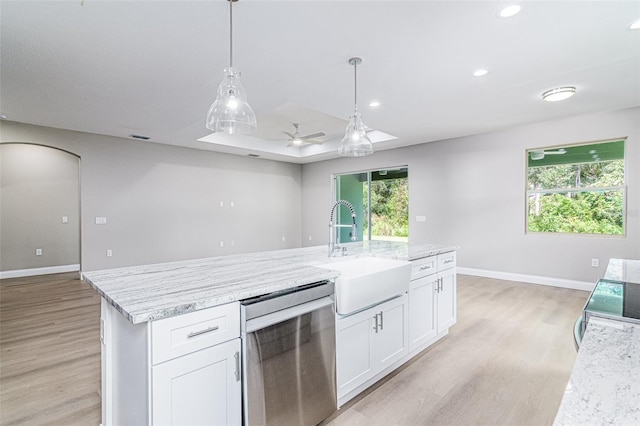 kitchen with sink, stainless steel dishwasher, ceiling fan, light wood-type flooring, and white cabinetry