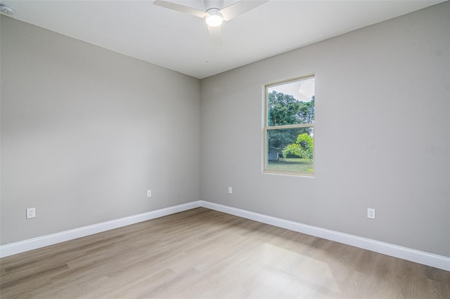 spare room featuring ceiling fan and light wood-type flooring