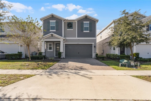 view of front property with a front yard and a garage