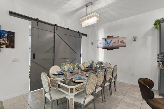 dining space with a barn door, light tile patterned flooring, and a chandelier