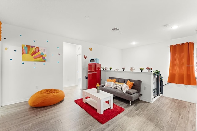 living room featuring light wood-type flooring