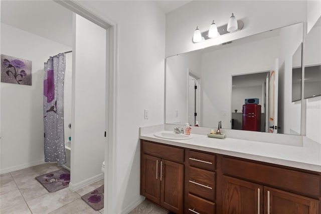 full bathroom featuring shower / bath combo, vanity, toilet, and tile patterned floors