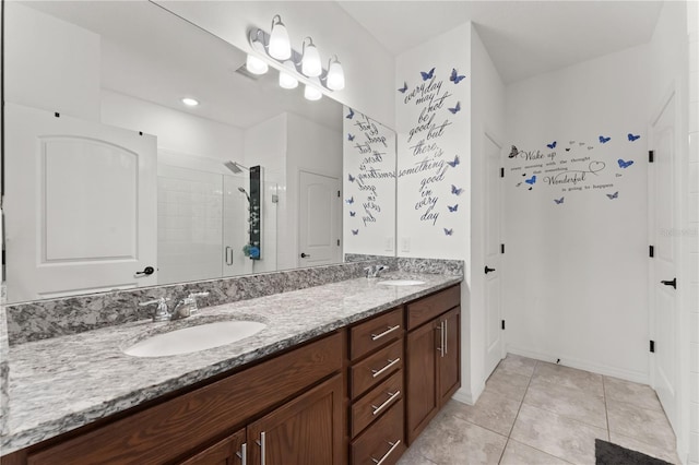 bathroom featuring tile patterned flooring, vanity, and an enclosed shower