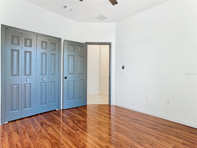 unfurnished bedroom featuring light hardwood / wood-style floors and ceiling fan