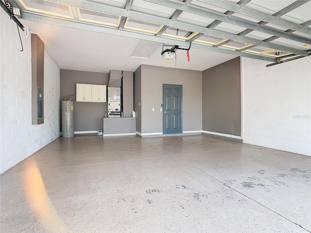 garage with a garage door opener, electric water heater, and heating unit