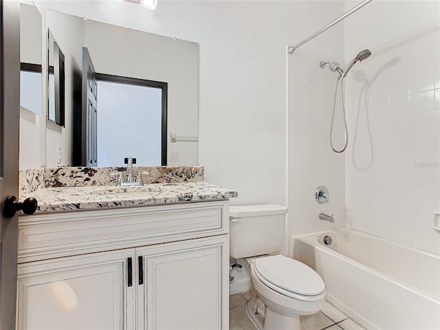 full bathroom featuring toilet, vanity, tile patterned floors, and tub / shower combination