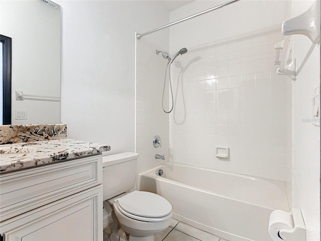 full bathroom with vanity, tiled shower / bath combo, toilet, and tile patterned floors