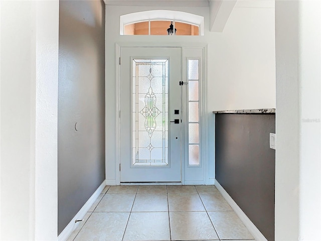 3623 Weatherfield Dr, Kissimmee, FL 34746 - foyer entrance featuring baseboards and light tile patterned flooring