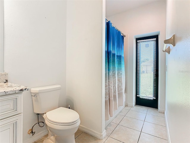 full bathroom with vanity, shower / bath combo, toilet, and tile patterned flooring