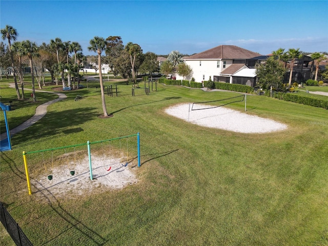 view of community with a yard and volleyball court