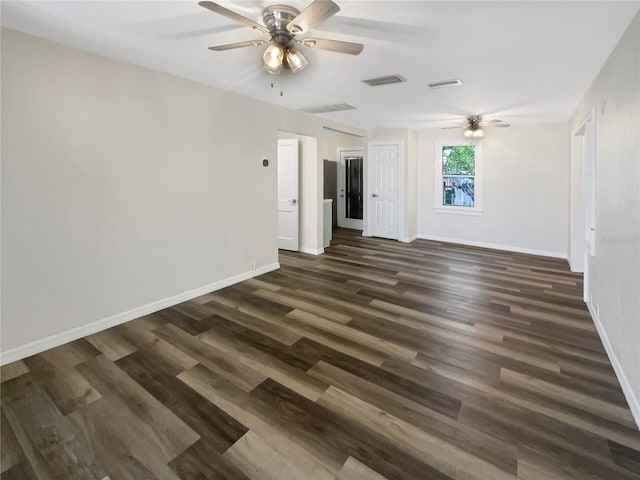 empty room featuring ceiling fan and dark hardwood / wood-style flooring