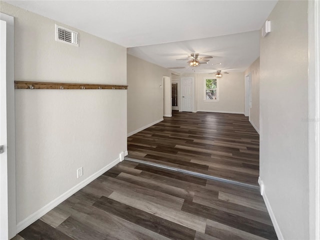 hallway with dark wood-type flooring