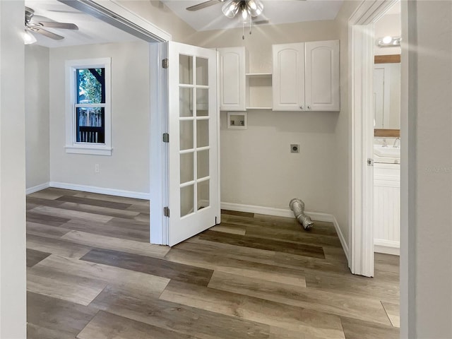 washroom with ceiling fan, hardwood / wood-style flooring, cabinets, and hookup for an electric dryer