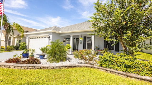 view of front facade featuring a garage and a front yard