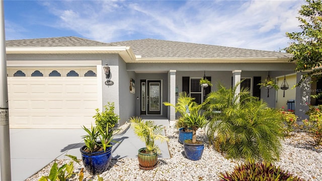 view of front of house featuring covered porch and a garage