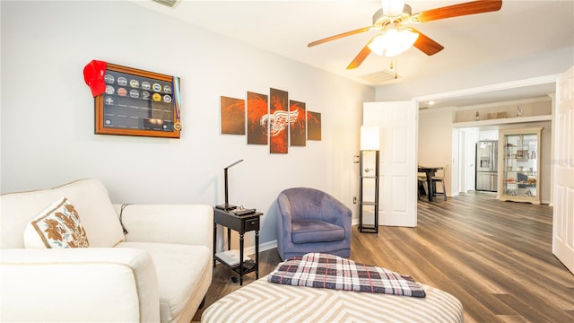 living room with ceiling fan and hardwood / wood-style floors