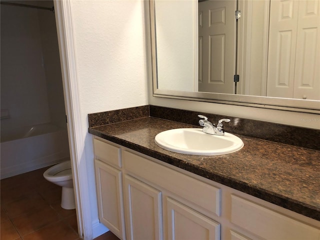 full bathroom with toilet, shower / bathing tub combination, vanity, and tile patterned floors