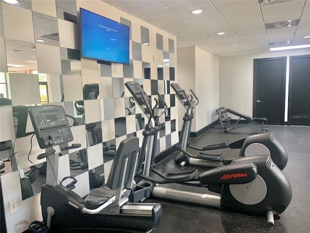 exercise room with a drop ceiling