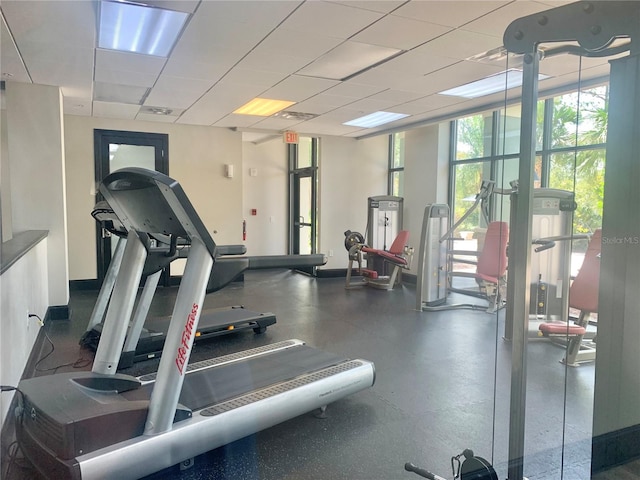 exercise room featuring a paneled ceiling