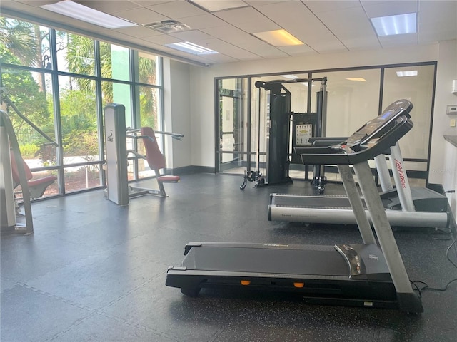 exercise room featuring a paneled ceiling