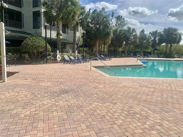 view of pool featuring a patio